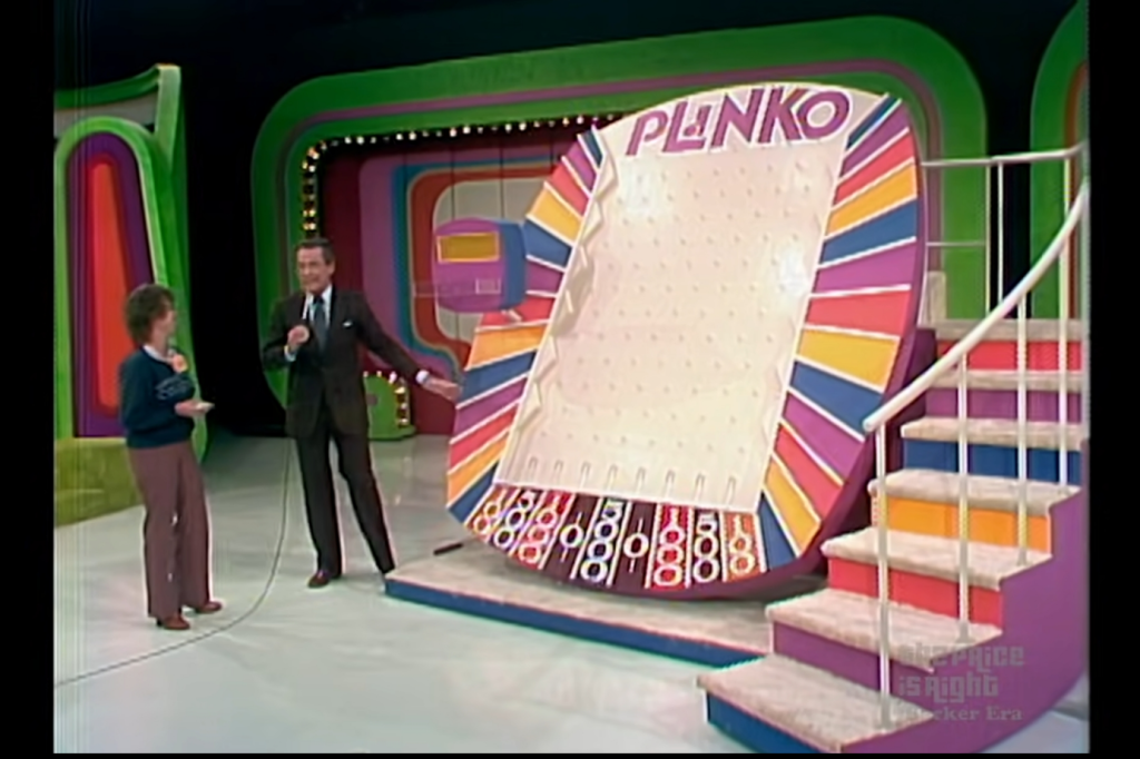 Bob Barker and a contestant beside the newly introduced Plinko board