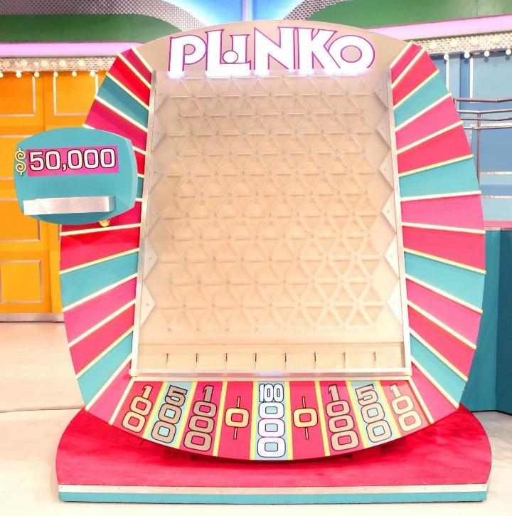 Full television Plinko board with pegs, side guides, and nine cash pockets